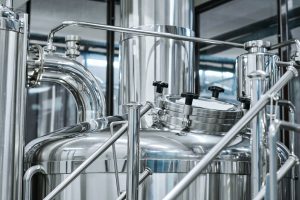 Big tank with beer in bottling plant